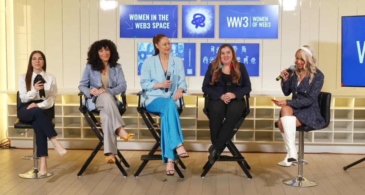 The UNGA78 Women in the Web3 Space panel on stage, five panellists with microphones. Carley Beck is at the centre, in a pale blue jacket